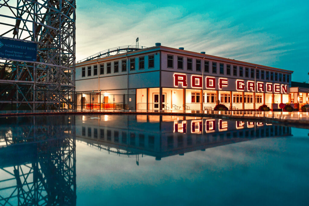 a photo of the Roof Garden building in front of a pool