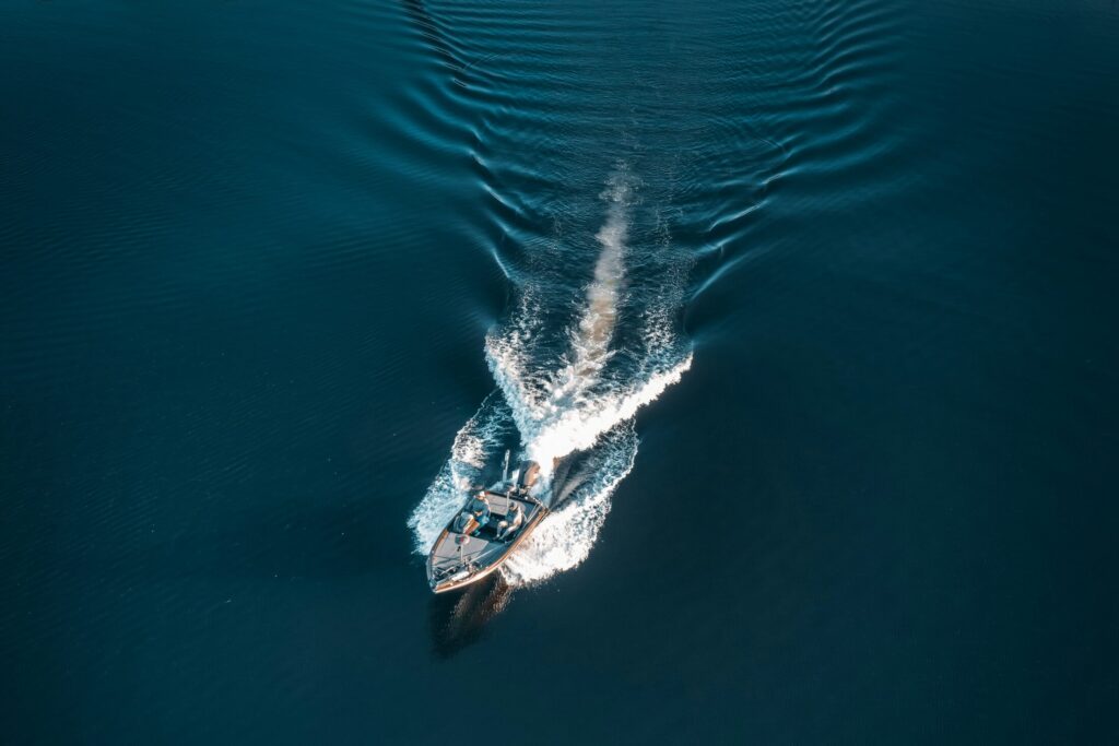 a small boat in the middle of a lake