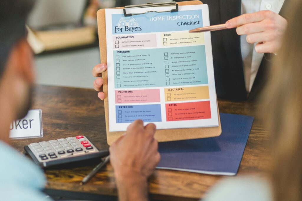 a person holding a clipboard with colored documents
