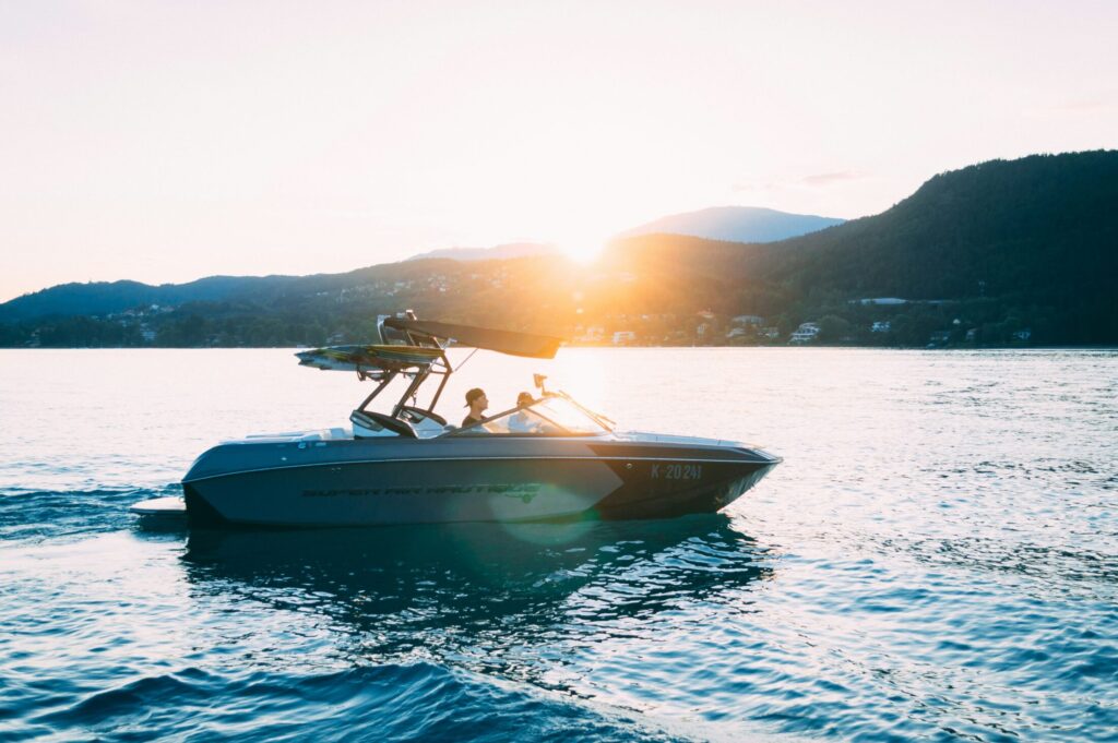 photo of people riding a speed boat