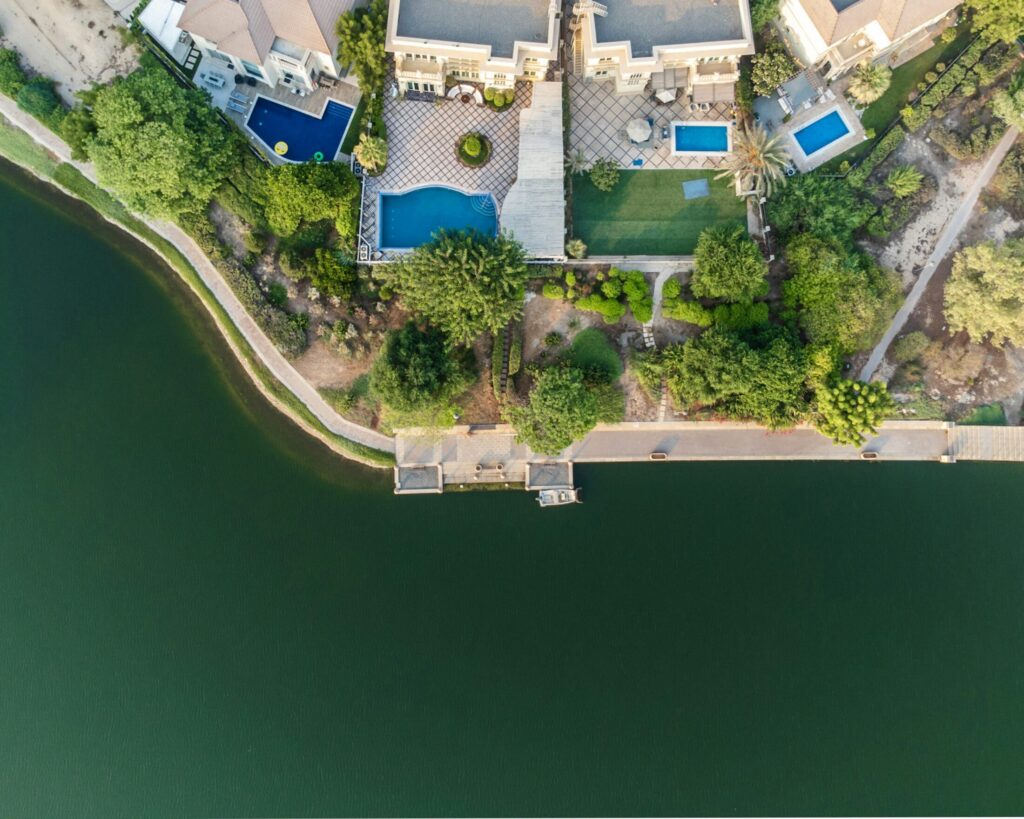 an aerial view of a house with swimming pool