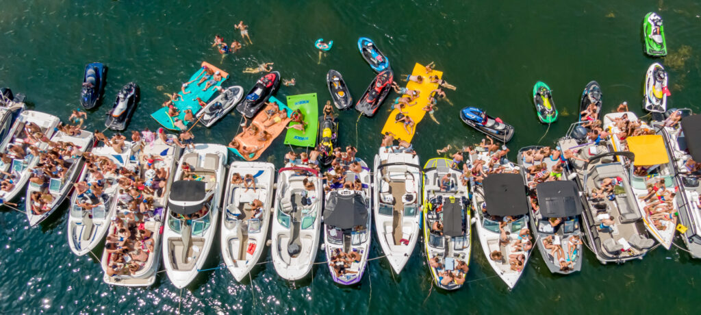 Boats Tied Together in Millers Bay on West Lake Okoboji, by Okoboji Realty