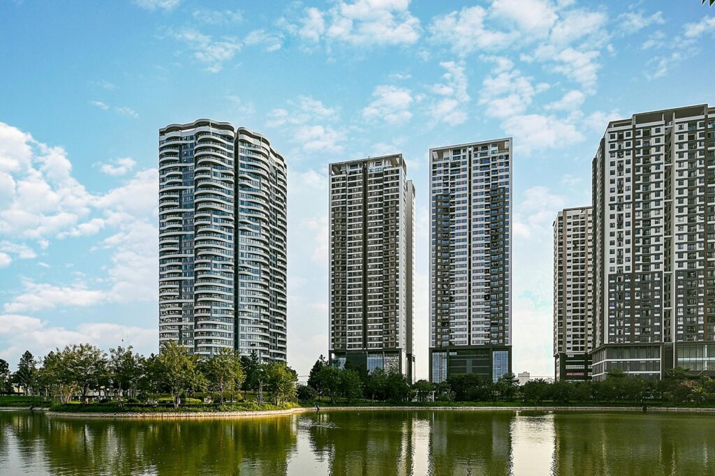 high rise buildings near a murky body of water
