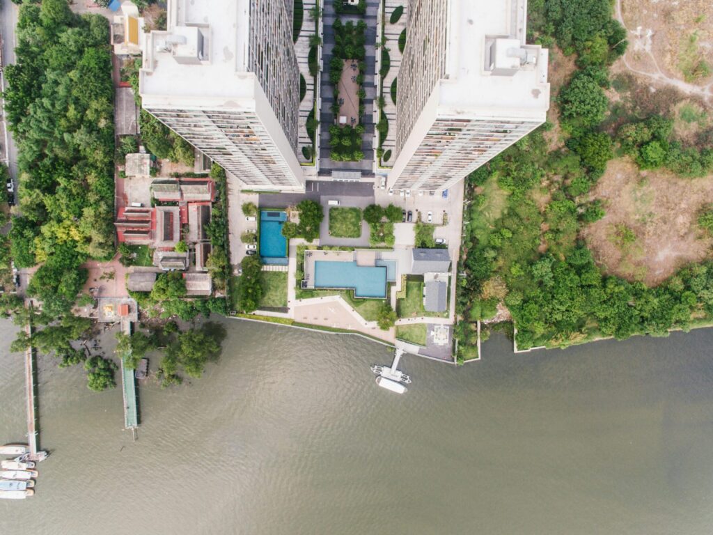 aerial shot of high rise buildings surrounded by trees