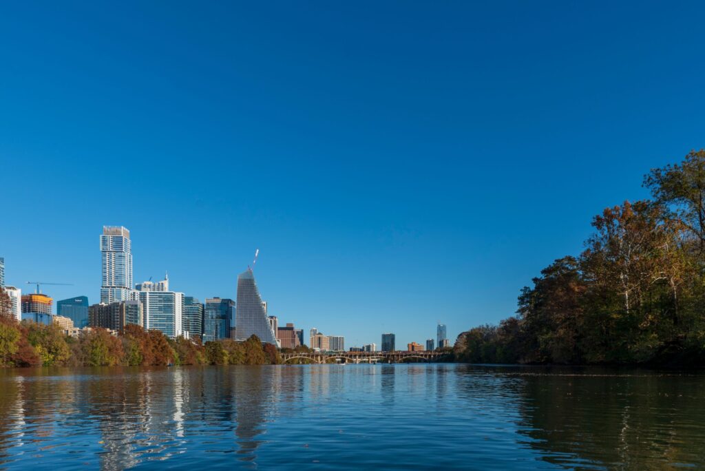 body of water under blue sky